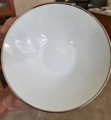 White china with a silver rim.
