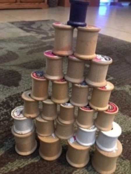 The uncovered spools placed in a tree pattern.