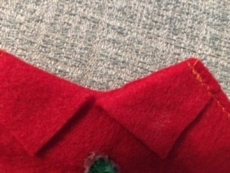 Sewing the red felt.