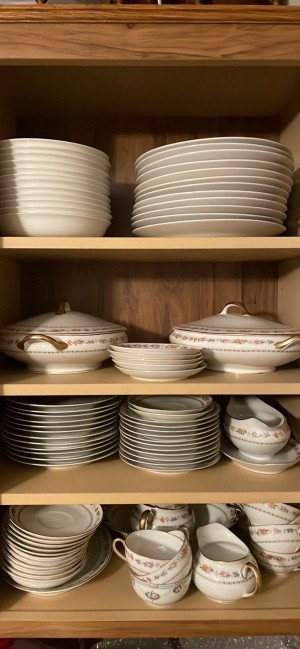 A set of china in a cupboard.