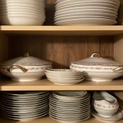 A set of china in a cupboard.