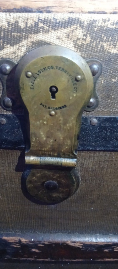 A lock on a steamer trunk.