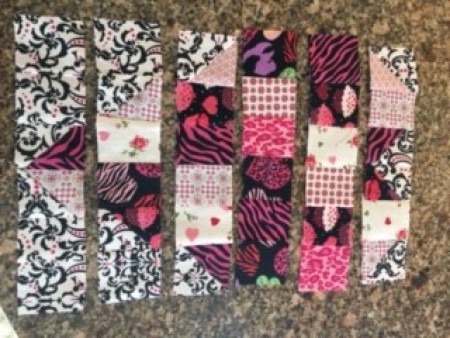 Laying out the quilt squares.