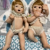 Two baby porcelain dolls.