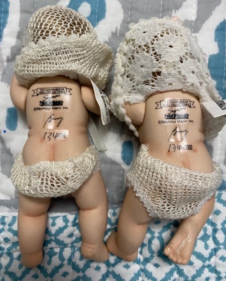 The backs of the two dolls.