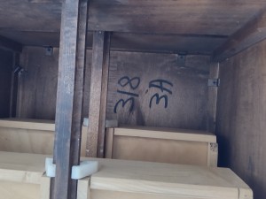Numbers written on the inside of the end tables.