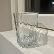 A clear glass with a ridged bottom.