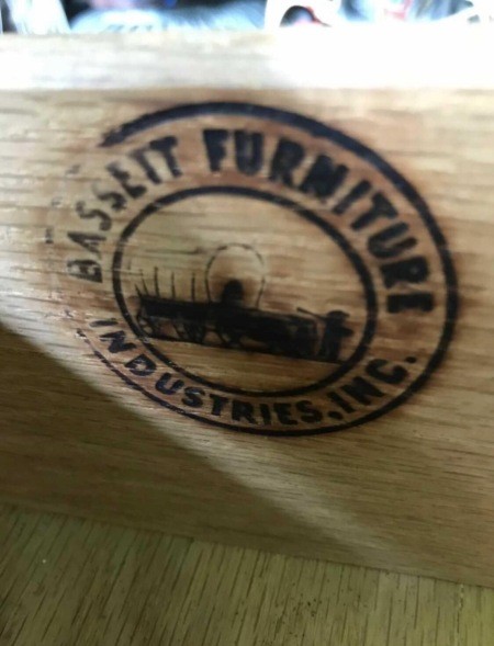 The Bassett Furniture logo inside a drawer.