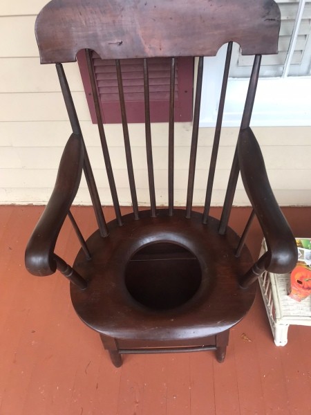 A wooden potty chair.