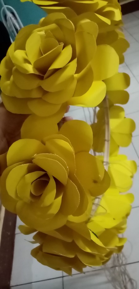 Tying flowers to the strings.