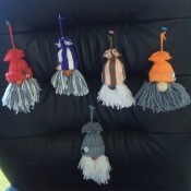 Little yarn ornaments shaped like gnomes.