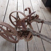 A rusty piece of farm equipment.