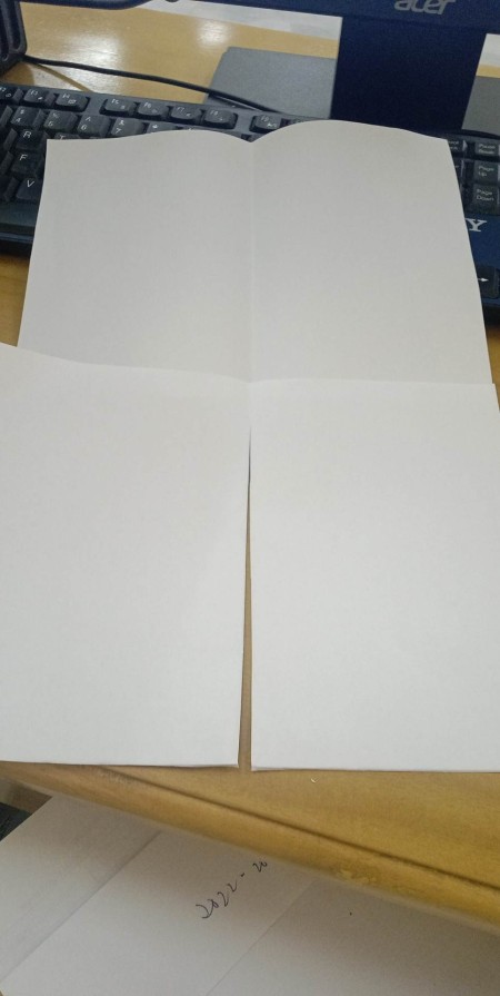 The paper cut in quarters.
