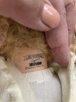 A marking on the back of a porcelain doll's neck.