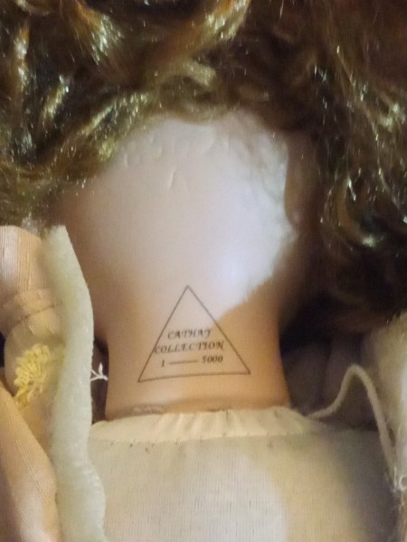 The back of a porcelain doll's neck.