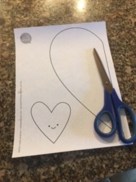 The heart shaped templates and a pair of scissors.