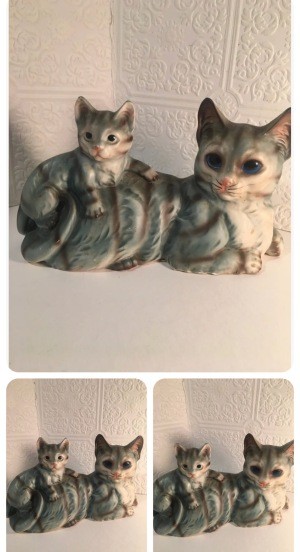 A figurine of a cat and a kitten.