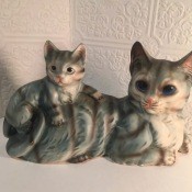 A figurine of a cat and a kitten.