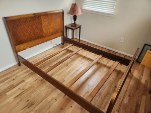 A vintage wooden bed frame.