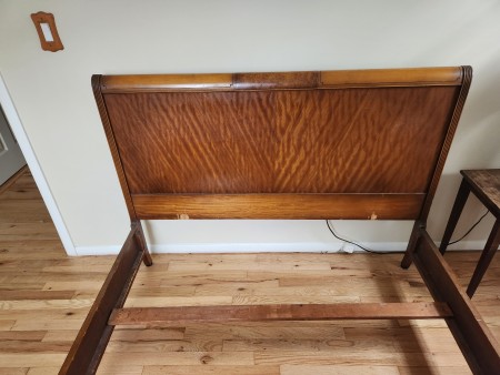 A vintage wooden bed frame.