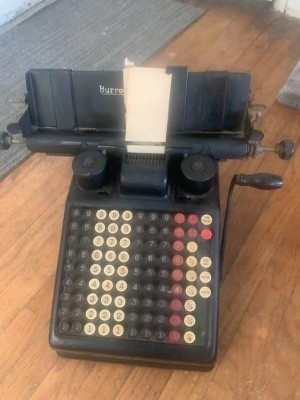 A vintage Burroughs adding machine.