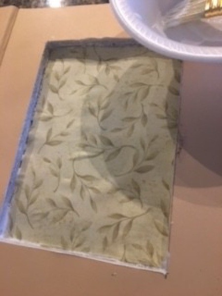 Lining the bottom with decorative paper.