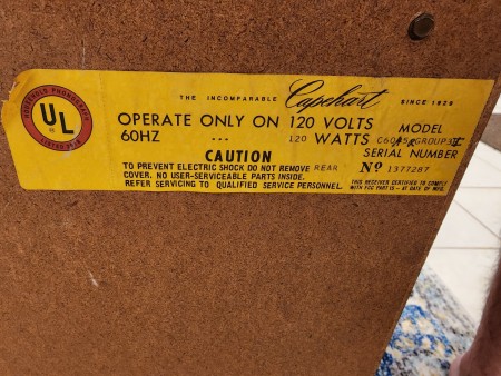 The marking on the back of a console stereo system.