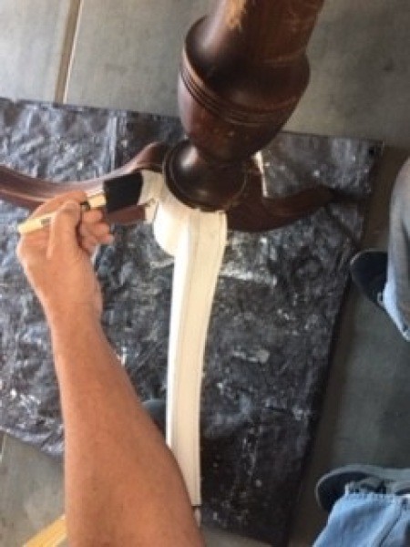 Painting the table legs.