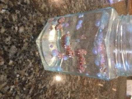 Adding water to the jar.