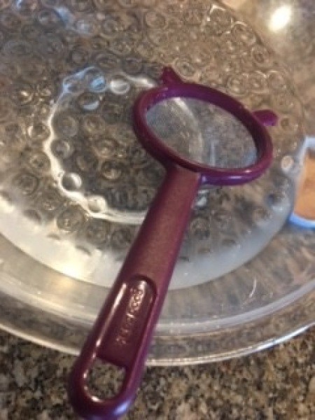 Removing the filled water beads.