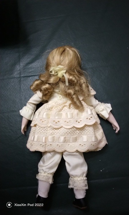 The back of a vintage doll.
