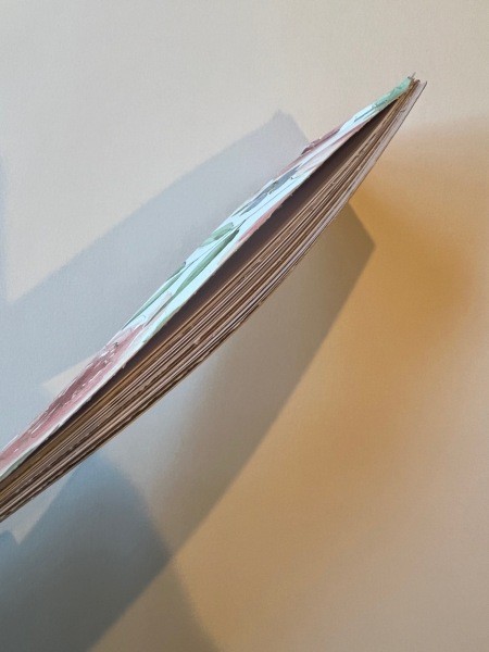 The edge of the notepad.