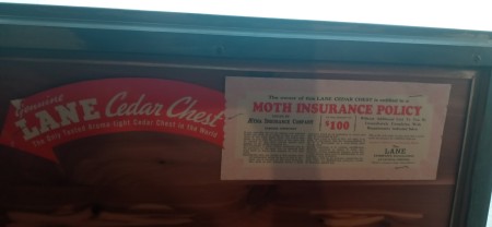 Markings on the inside of a cedar chest.