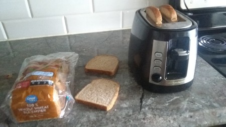 Toasting bread in a toaster.