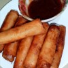 A plate of the fried rolls and sauce.