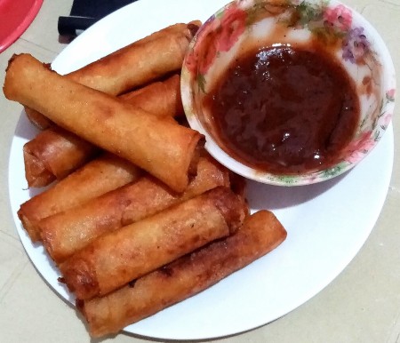 A plate of the fried rolls and sauce.
A plate of the fried rolls and sauce.