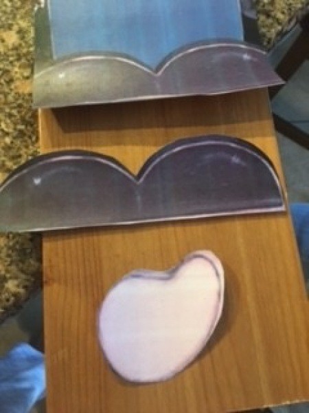 Cutting out the hands and feet of the gnome.