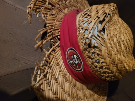 A old and worn straw hat.