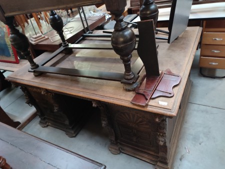 An old wooden double sided desk.