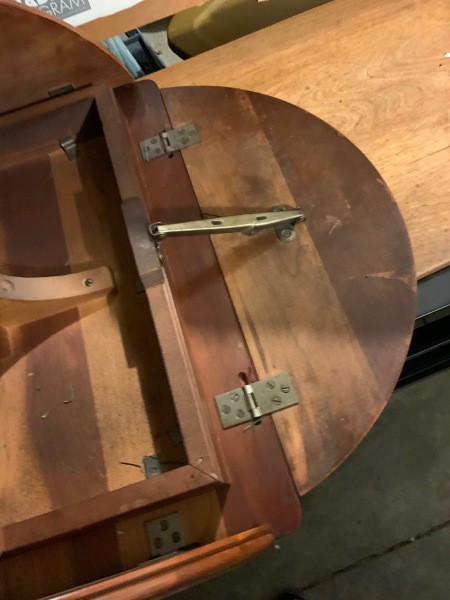 The underside of a wooden table.