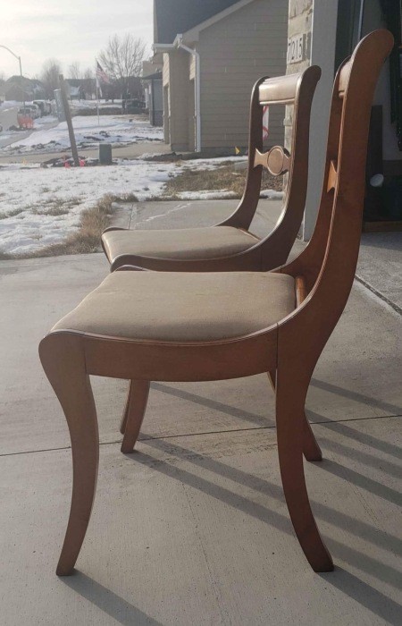 Two dining chairs from the side.