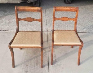 Two wooden dining chairs.