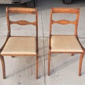 Two wooden dining chairs.