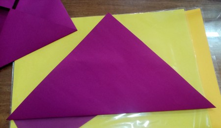 Folding origami paper.