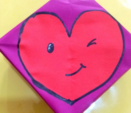 Adding a heart to the box.