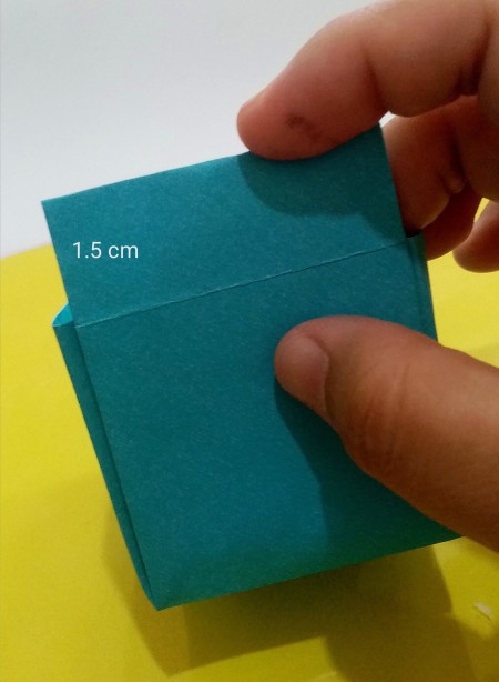 Folding paper to make the box.