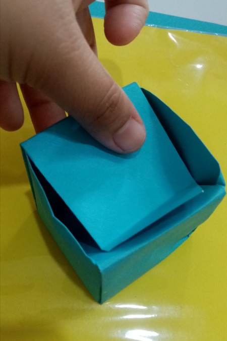 Folding paper to make the box.