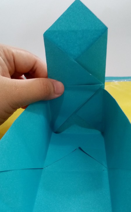 Folding paper to make the box.
