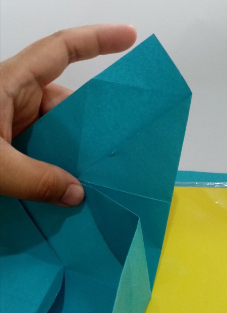 Folding paper to make the box.