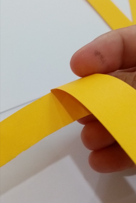 Joining the strips of paper.